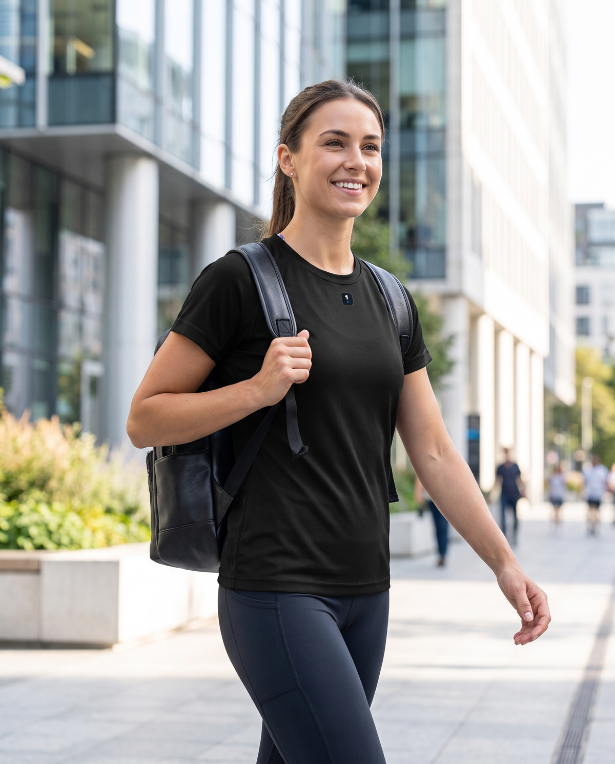 Woman wearing Base1 Active Women's Performance T-Shirt on a city commute