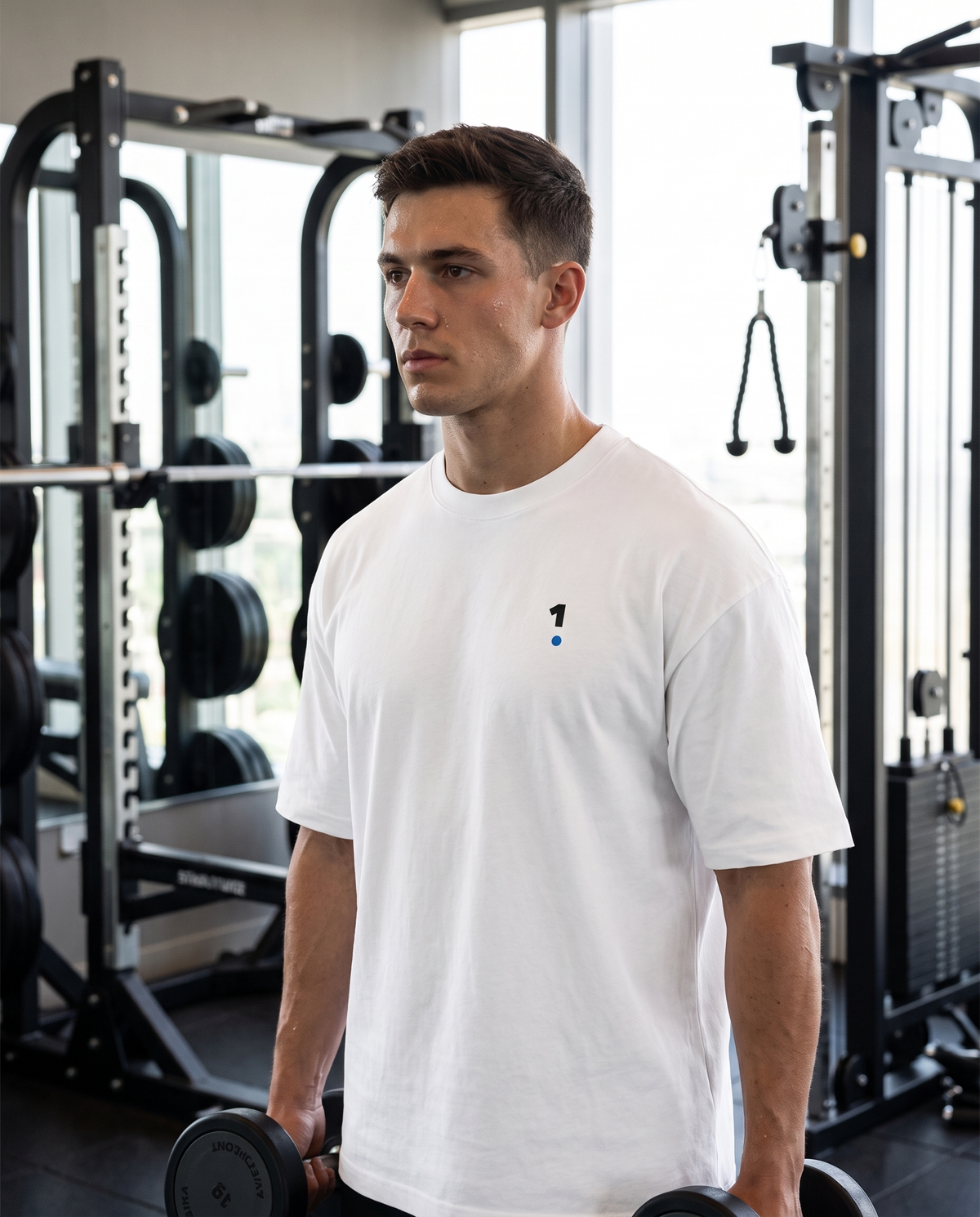 Man wearing Base1 Active 1 Logo Tee in a gym
