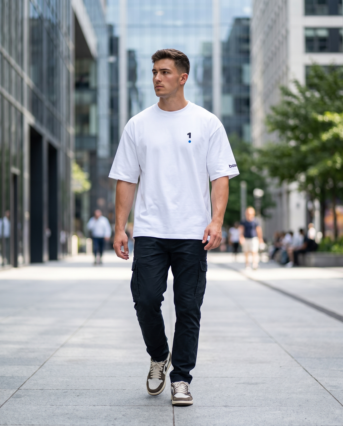 Man wearing Base1 Logo Oversized Heavyweight Tee on a city street