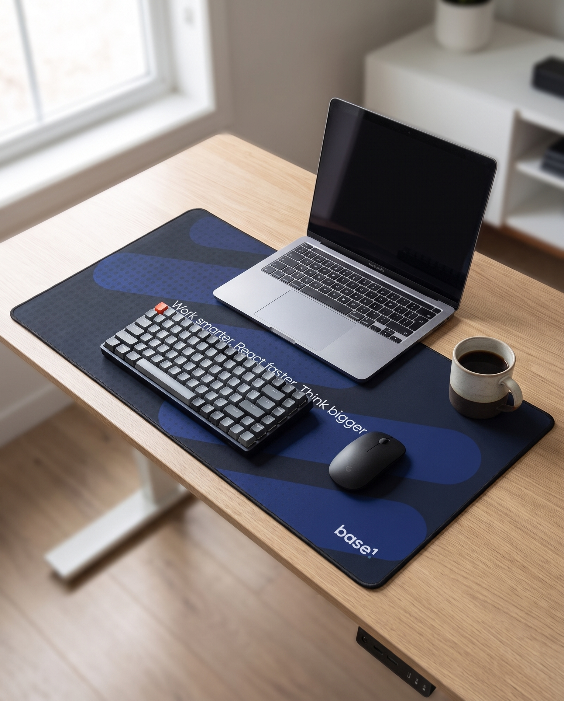 Base1 Desk Mat on a tech desk with laptop and keyboard