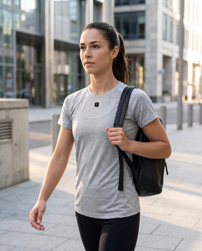 Woman wearing Base1 Active 1 Icon Logo Performance T-Shirt on a city commute