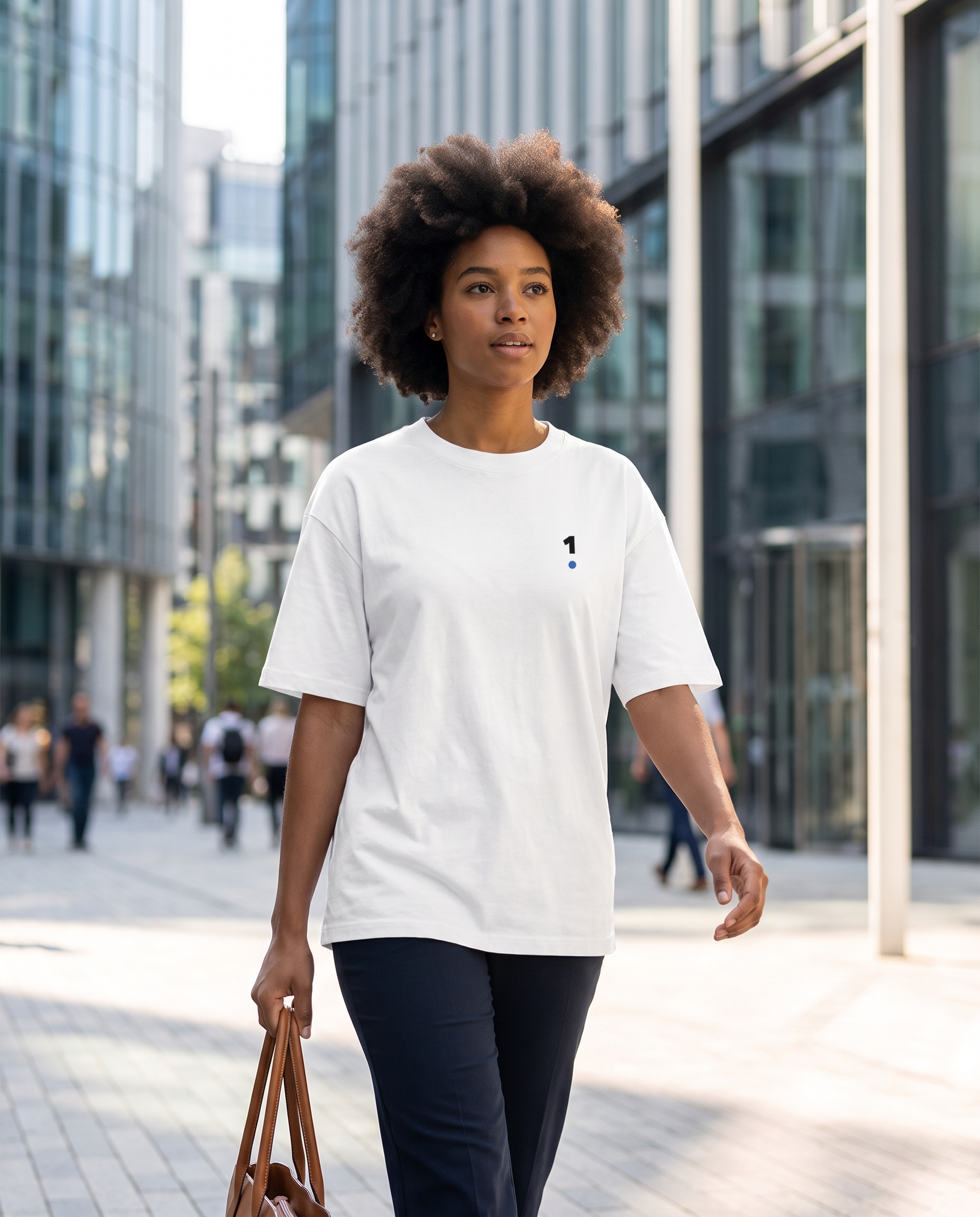Woman wearing Base1 Active 1 Logo Tee on a city commute