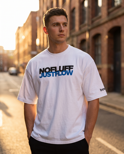 Man wearing Base1 Just Flow oversized heavyweight t-shirt on a city street