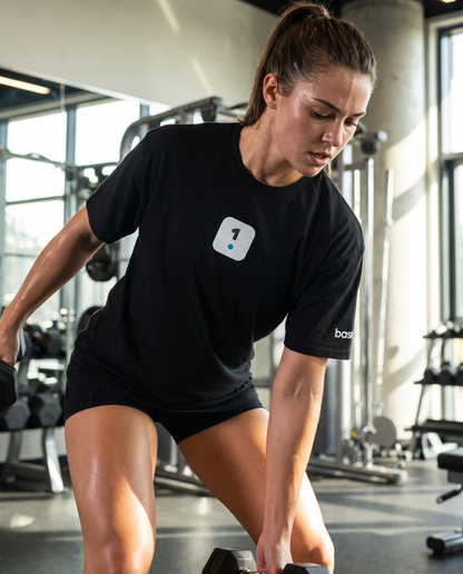 Woman wearing Base1 Logo Classic T-shirt in a gym