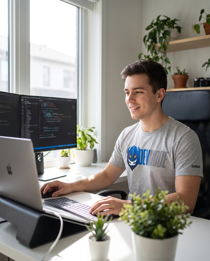 Developer working from home wearing Dev Mode unisex t-shirt