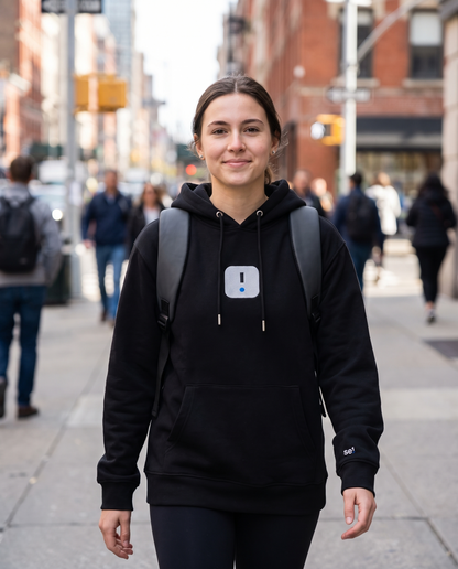 Woman wearing Base1 Icon Logo Eco Hoodie commuting in the city