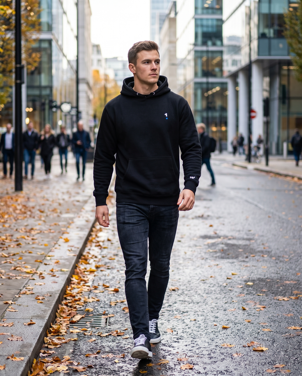 Man wearing Base1 Logo Unisex Hoodie on a city street