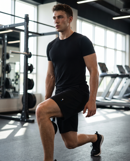 Man wearing 1 Logo Men's fleece shorts in a gym