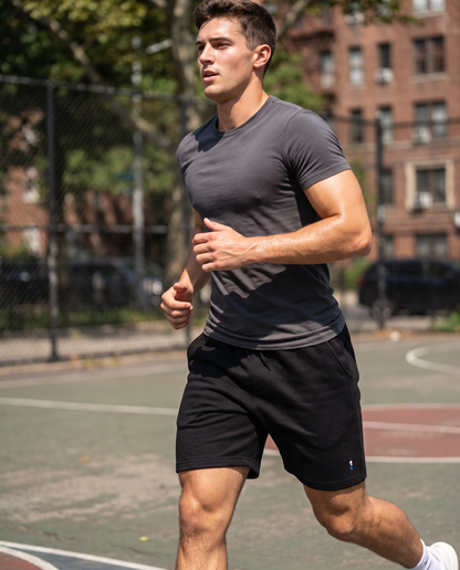 Man in 1 Logo Men's fleece shorts on an outdoor court
