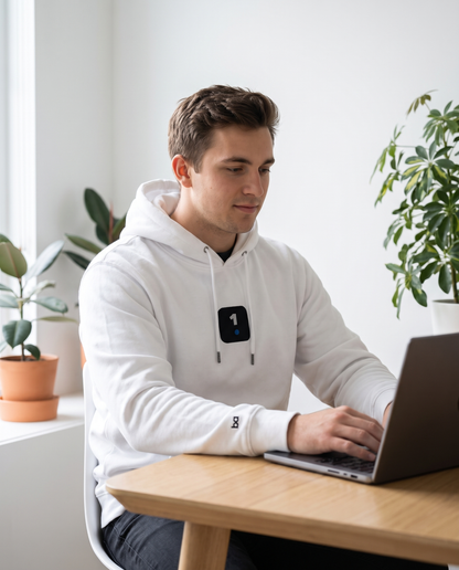 Man wearing Base1 Icon Logo Eco Hoodie working from home
