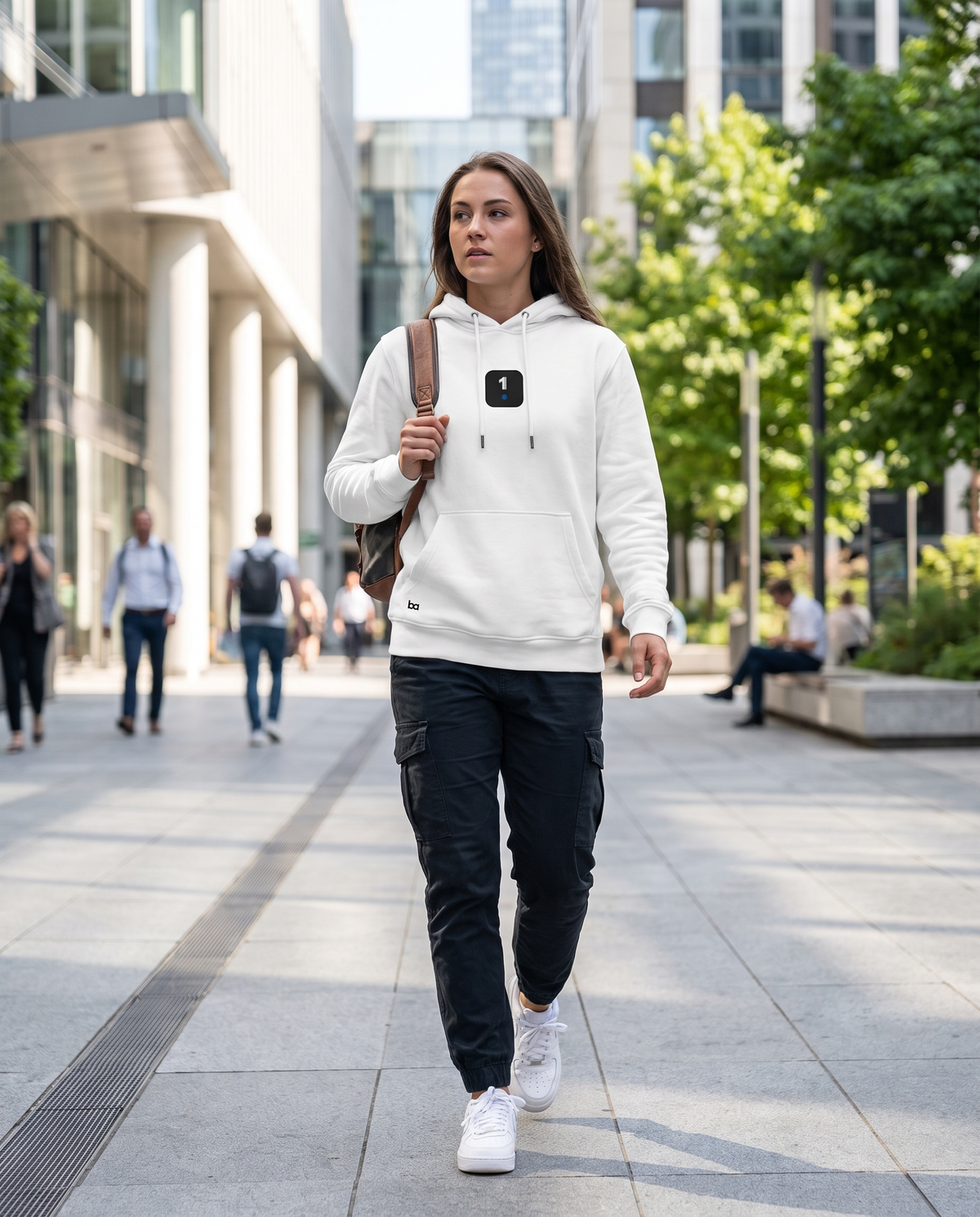 Woman wearing Base1 Icon Logo Eco Hoodie on a city street