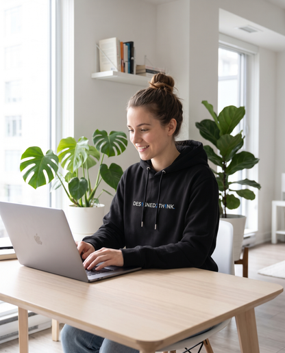Woman wearing DESIGNED2THINK Eco Hoodie Remix working from home