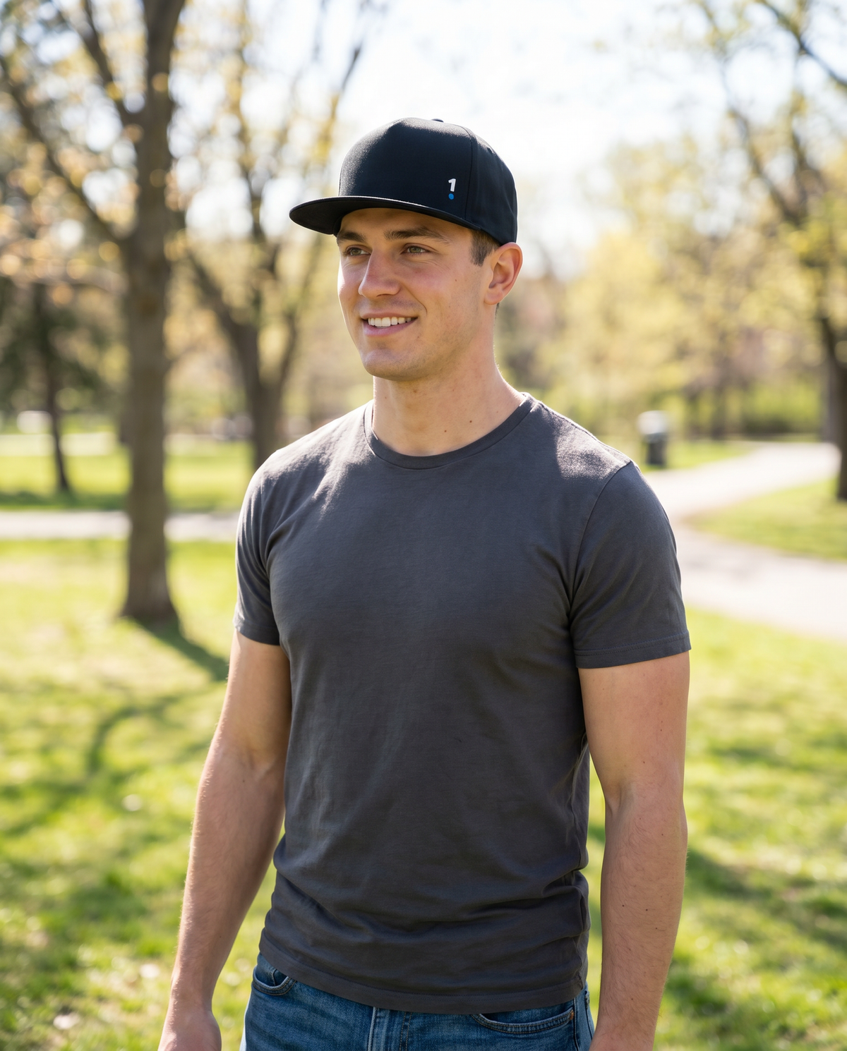 Man wearing Base1 Logo Snapback Cap in a park