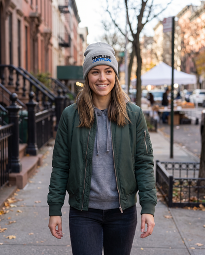 Woman wearing Base1 No Fluff Just Flow Beanie on a city street