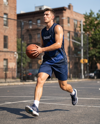 Man wearing Base1 Halftone basketball jersey on an outdoor court