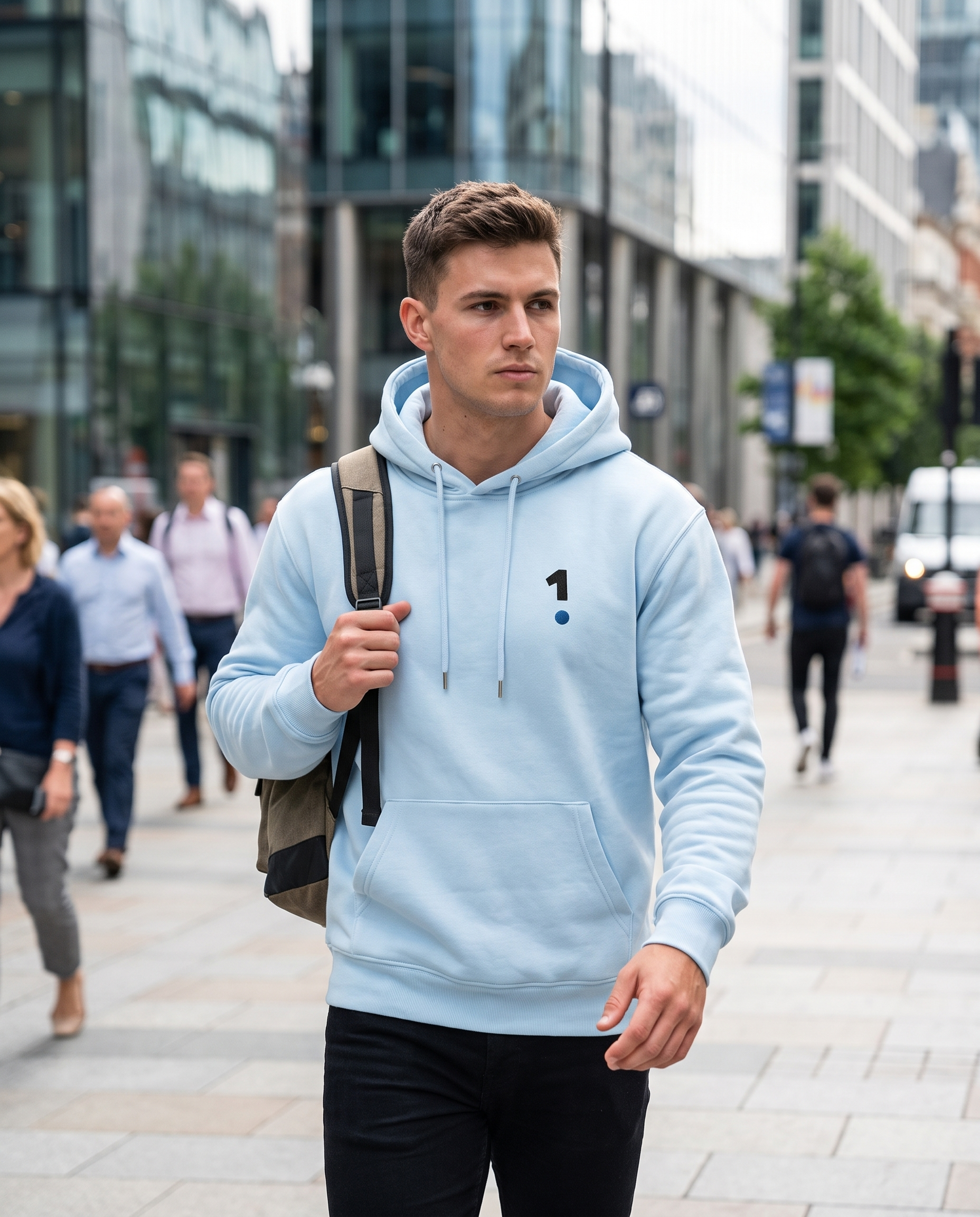 Man wearing Base1 Logo Unisex Hoodie on a city street