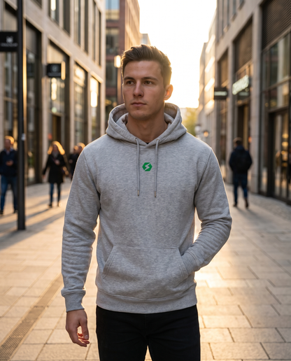 Man wearing BaseFit Cruiser Organic Hoodie Heather on a city street