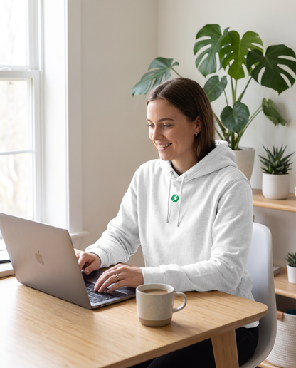 Woman wearing BaseFit Cruiser Organic Hoodie Heather working from home