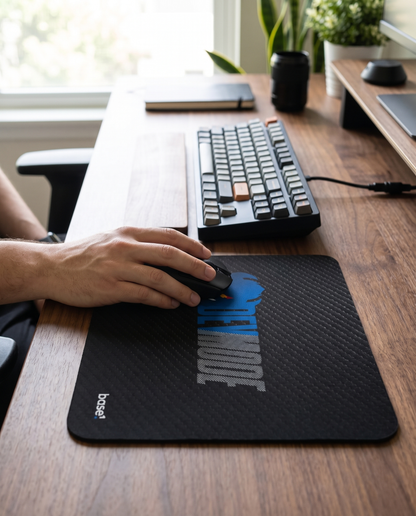 Dev Mode Mouse Pad on a desk with a hand resting a mouse