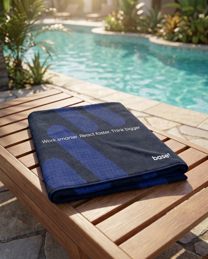 Base1 Think Bigger towel folded by a resort pool