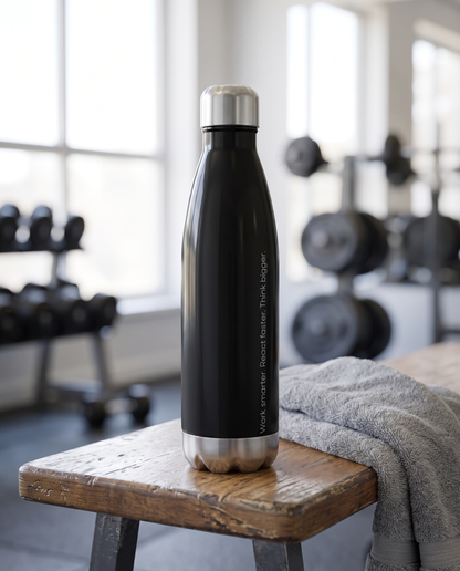 Base1 Work Smarter water bottle on a gym bench