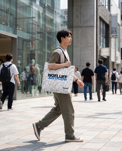 Person carrying Base1 Just Flow tote bag in the city